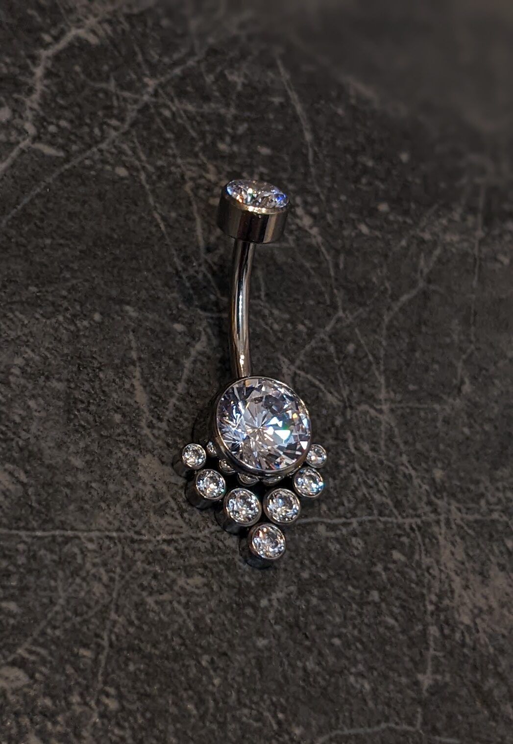 Big shiny navel bar image 1