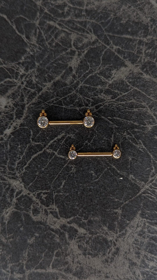 Bezel nipple bar con perline PVD oro image 0