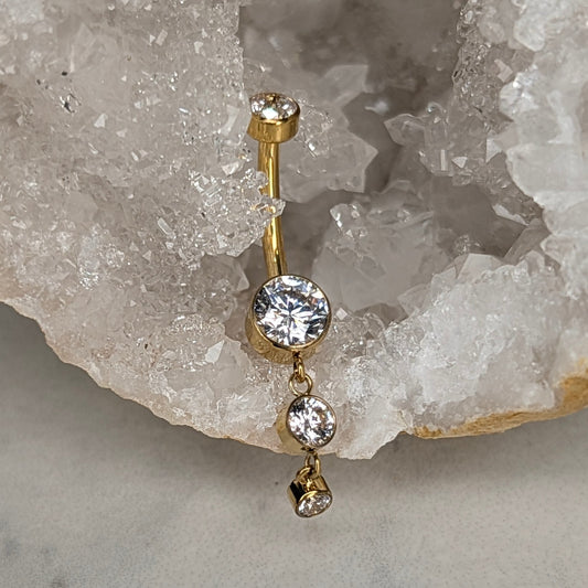 Dangling bezel navel bar PVD gold